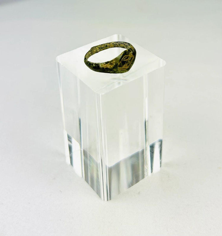 Close-up of engraved intaglio design on Roman bronze ring bezel.