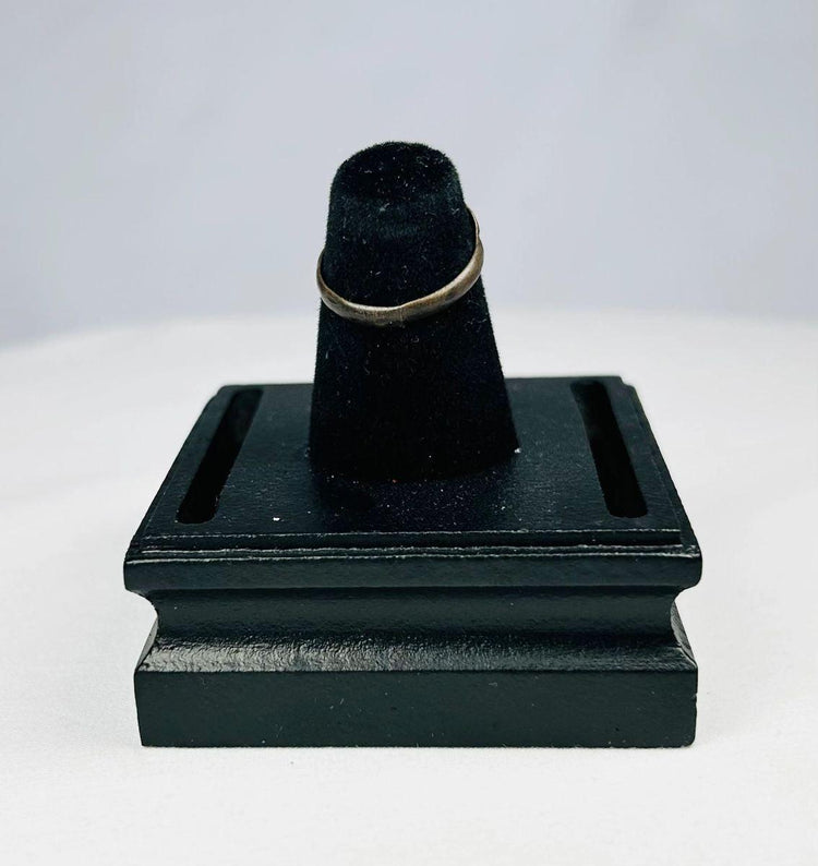 Antique silver ring featuring three oval motifs and natural patina