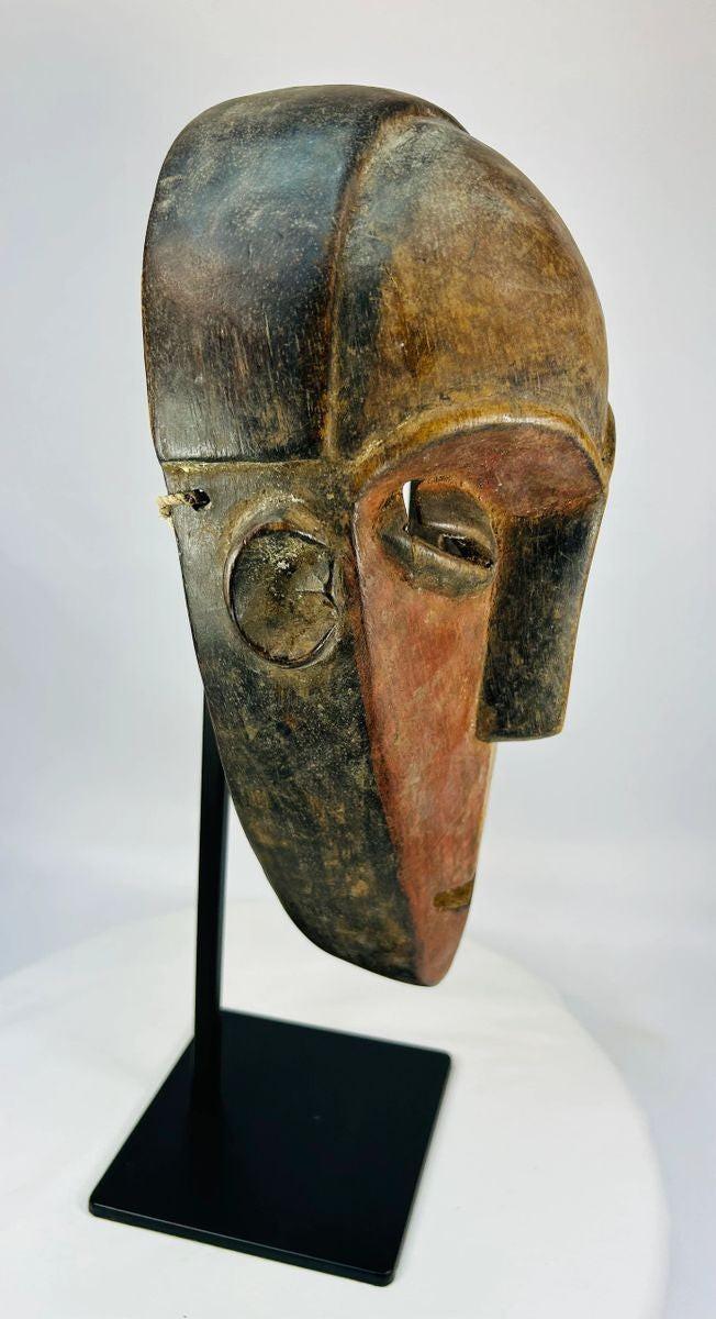 Dan ceremonial mask circa 1930–1950 with dual-tone pigment and patina