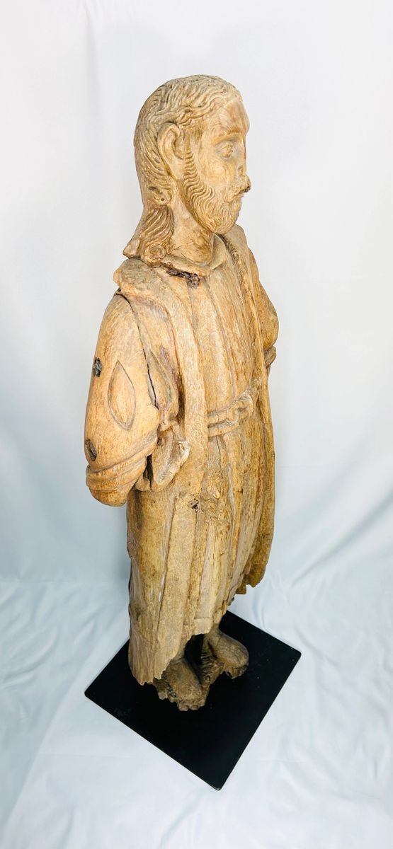 Large 41-inch medieval to Renaissance carved wooden statue of a saint or biblical figure, detailed hair and robes, mounted on iron display base with natural aged patina – European ecclesiastical sculpture.