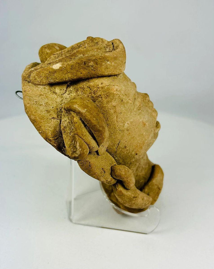 Ancient ritual terracotta head sculpture, three-quarter view, Mesoamerican origin