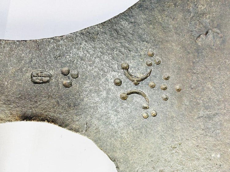 Heavy forged iron executioner’s axe from Europe, 18th century, featuring decorative guild stamp marks.