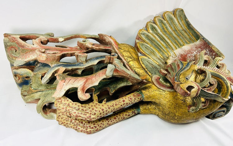 Angled view of Qing Dynasty phoenix relief sculpture carved from camphor wood, featuring gilded wings, red and blue polychrome pigments, and ornate openwork detailing – Relic and Rarity.