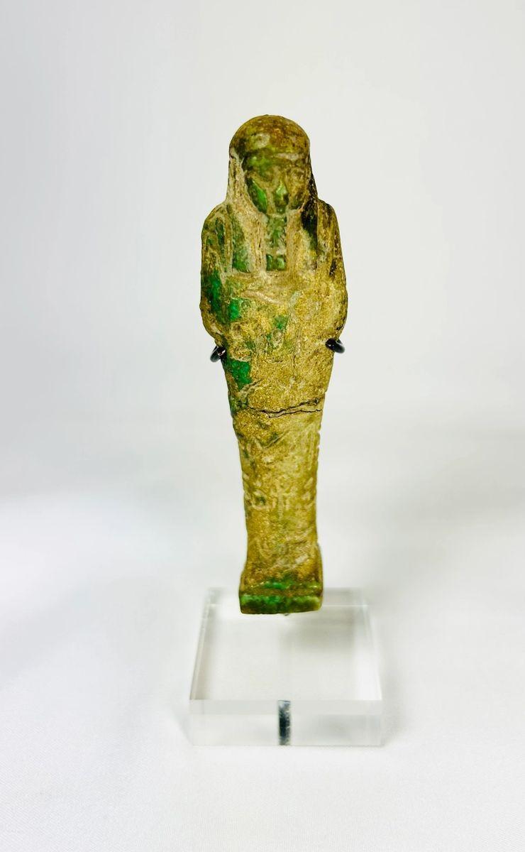 Egyptian Ushabti with tripartite wig striated beard and crossed arms holding tools