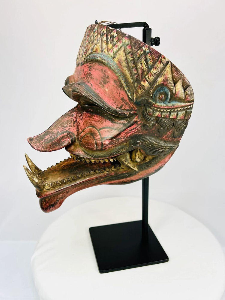 Traditional Indonesian dance mask (Cakil), late 19th century, photographed in angled profile.