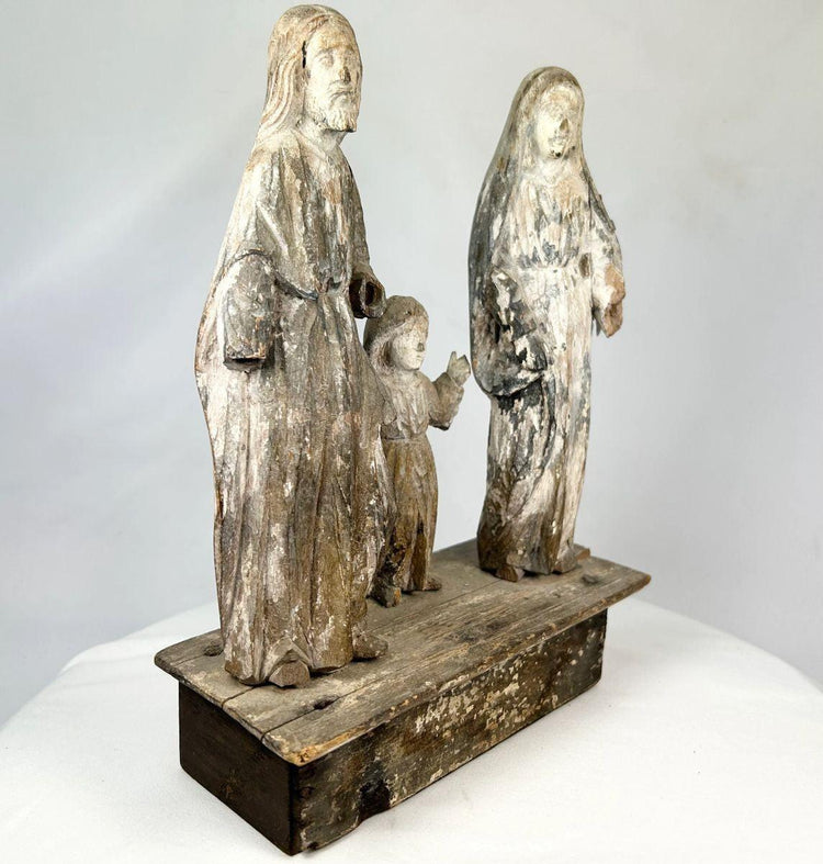 Weathered antique santo statue set with aged patina