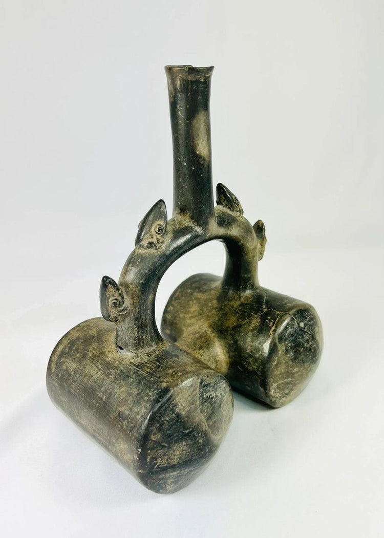 Ancient Chimu greyware vessel featuring dark burnished surface