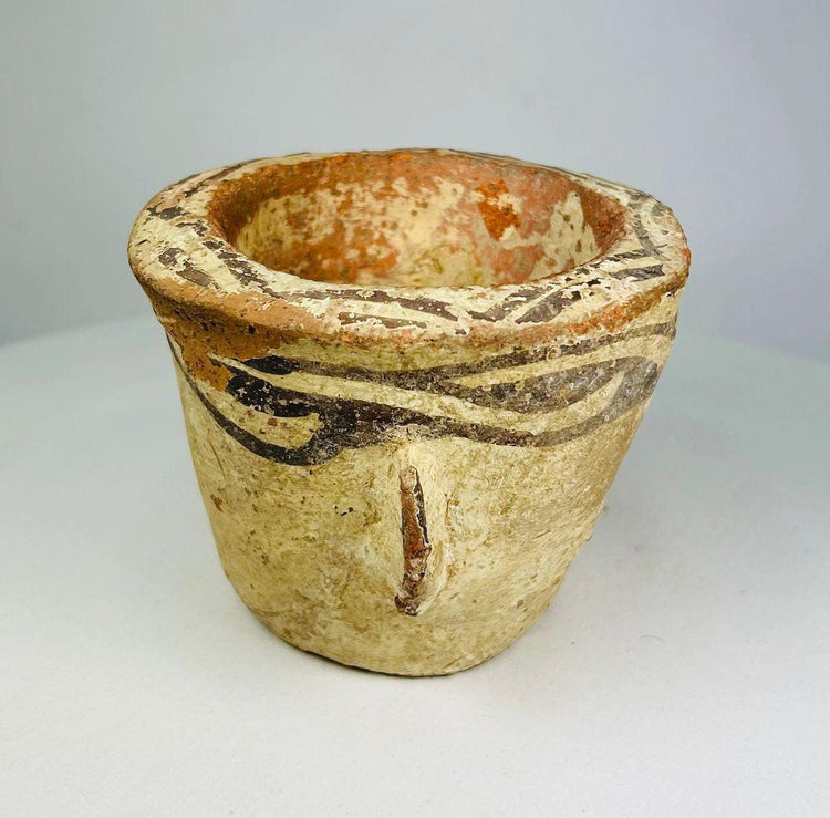 Side profile showing the rounded form of an Islamic terracotta mortar