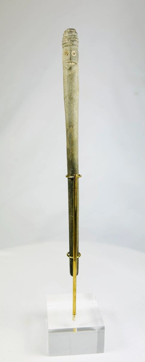 Tall ritual stone object from ancient Bactria, carved with two human faces and exhibiting burial patina.