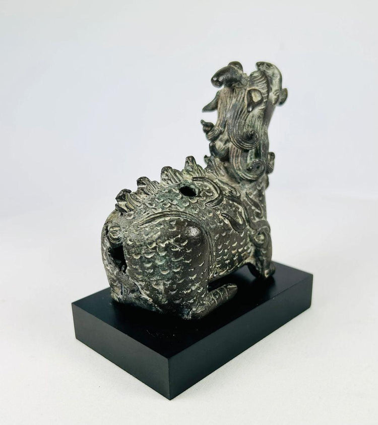 Right-side angle of Qing Chinese bronze incense burner shaped as a Qilin, showing muscular haunches and decorative mane.