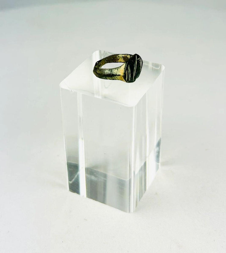 Authentic Roman Empire bronze signet ring showing raised oval bezel and patina