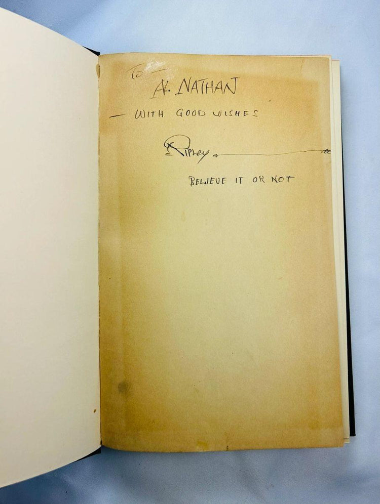 1929 first edition, 9th printing of Ripley’s Believe It or Not! hardcover book, signed by Robert Ripley with personal inscription to A. Nathan, featuring green cloth cover and red lettering.