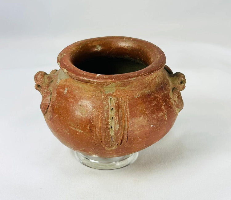 Small Pre-Columbian pottery vessel with intricate terracotta detailing and ceremonial design
