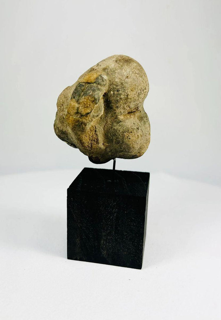 Ancient stone mask fragment reflecting early Mesoamerican artistry