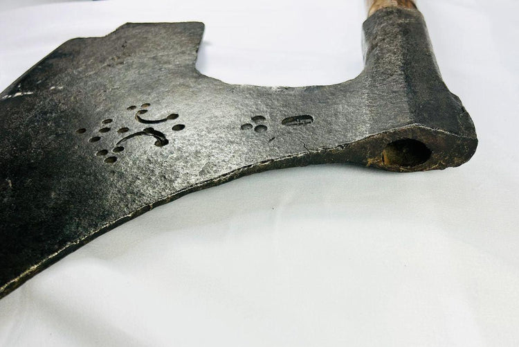Authentic 18th-century European executioner’s axe with patinated iron blade and historic guild markings.