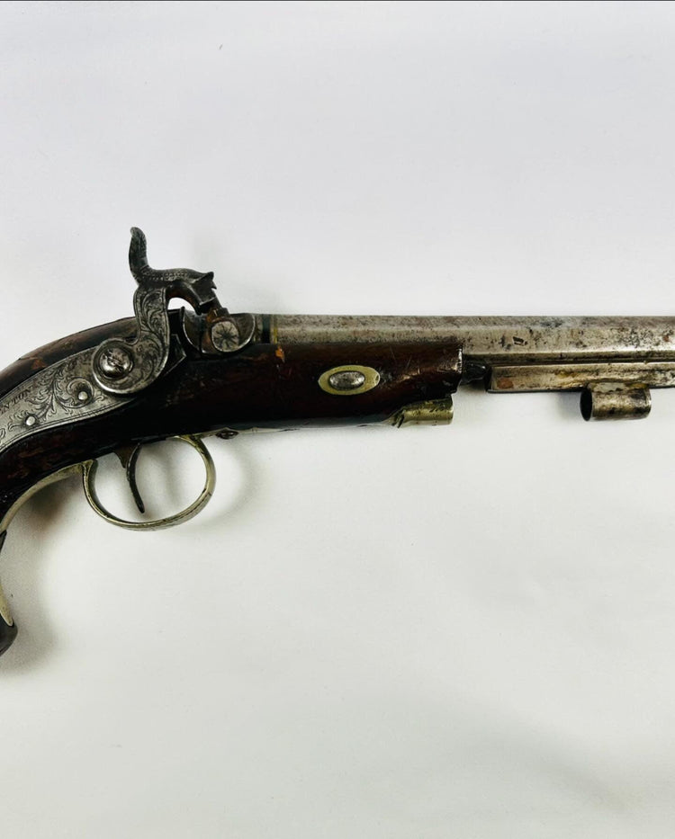 Close-up right-side view of antique Fenton London percussion pistol circa 1780–1830 showing engraved lockplate, hammer detail, and walnut stock on white background.