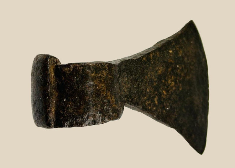 19th-century American forged iron axe head with wide blade, robust socket, and rich aged patina, used for timber work and settlement life.