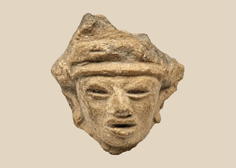 West Mexico terracotta head fragment, circa 200 BCE–300 CE, with almond eyes and stylized coiffure