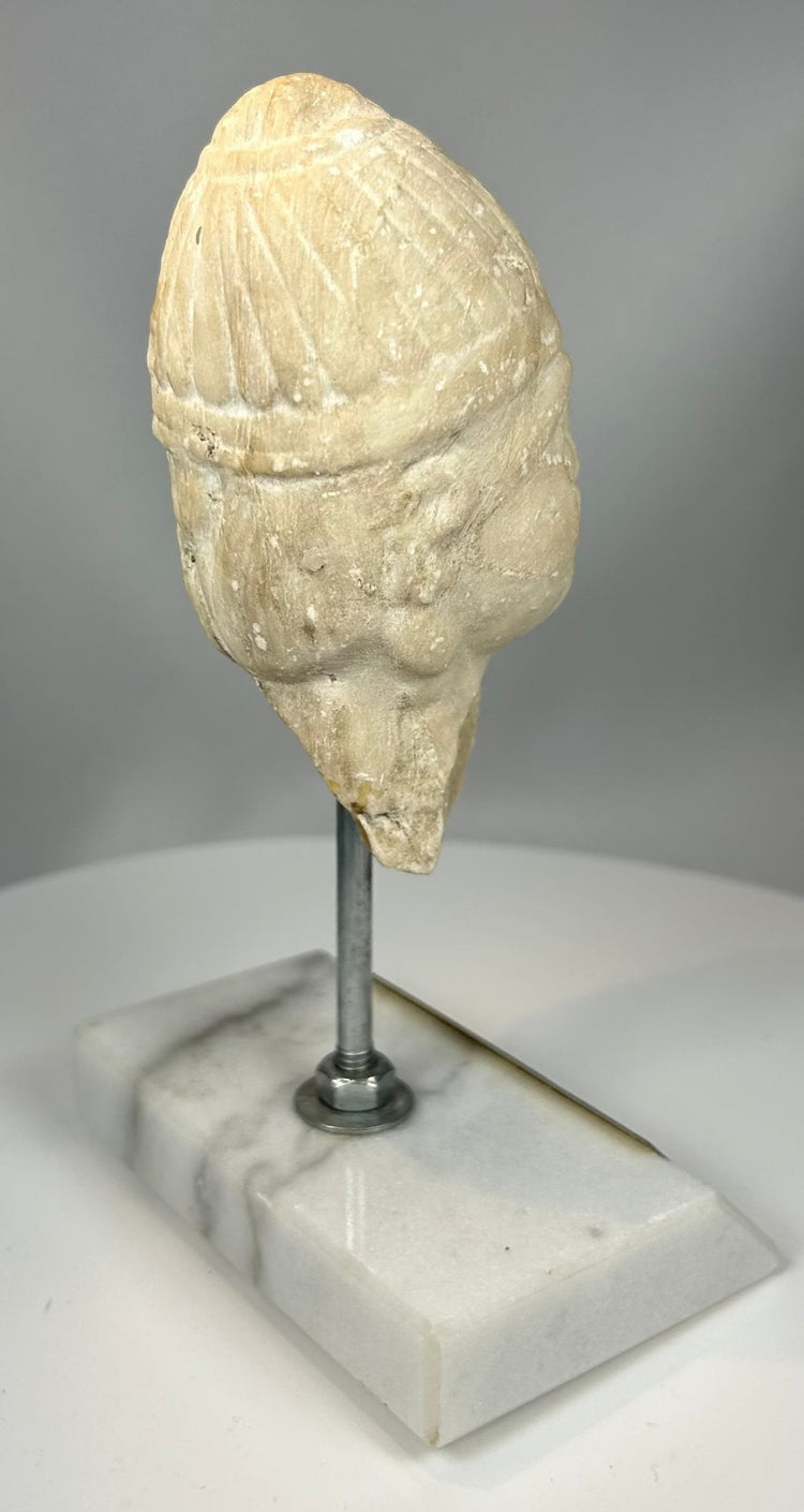 Bronze Age warrior head fragment with mineral patina and erosion