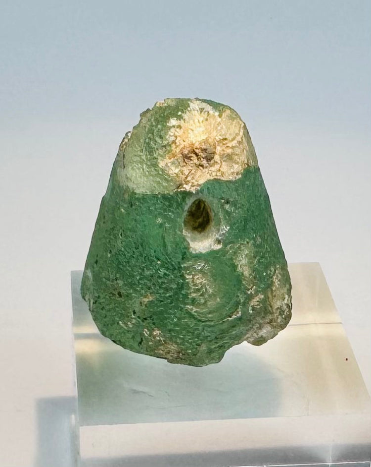 Iron Age glass stamp seal with domed body and transverse suspension hole