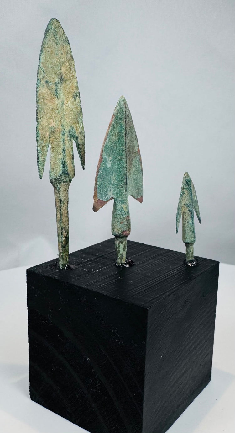Ancient Iranian Plateau bronze weapon points with mineral encrustation and earthen deposits