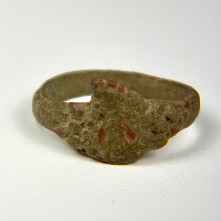 Ancient bronze ring with bold bezel design and naturally developed archaeological patina, circa 1st–5th century CE