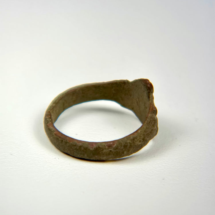 Ancient Middle Eastern bronze ring showing centuries of wear, oxidation, and surface weathering