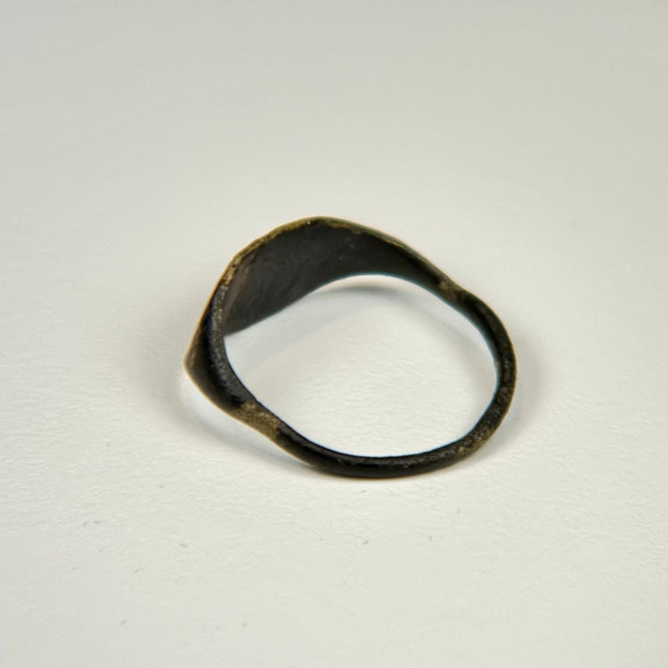 Mediterranean bronze ring with engraved animal design and centuries-old green surface patina