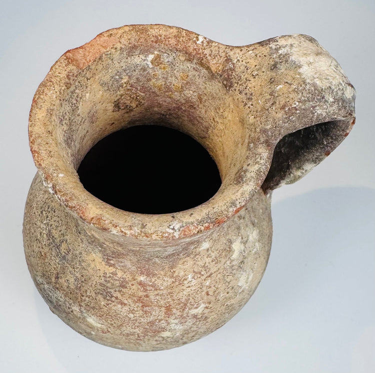 Ancient Eastern Mediterranean terracotta pitcher with rim chips and burial patina