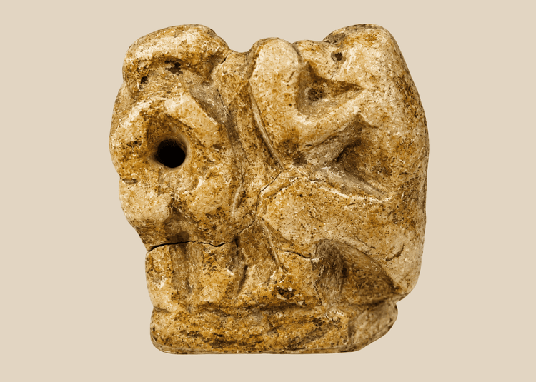 Ancient Egyptian carved limestone baboon figure associated with the god Thoth from the Late Period.