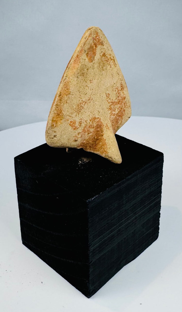 Egyptian-style uraeus relief fragment with weathered surface and projecting attachment