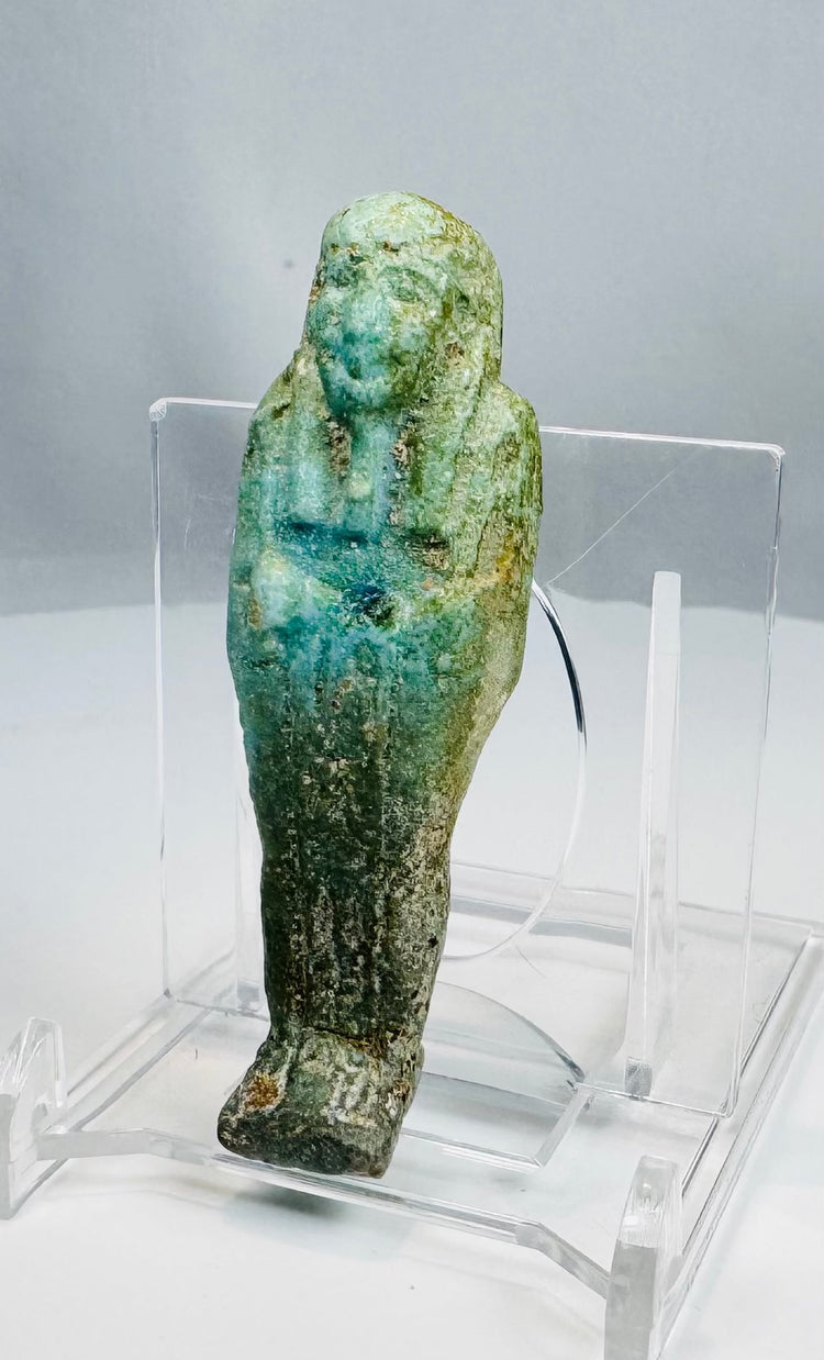 Ptolemaic Egyptian blue-green faience ushabti with crossed arms and tripartite wig