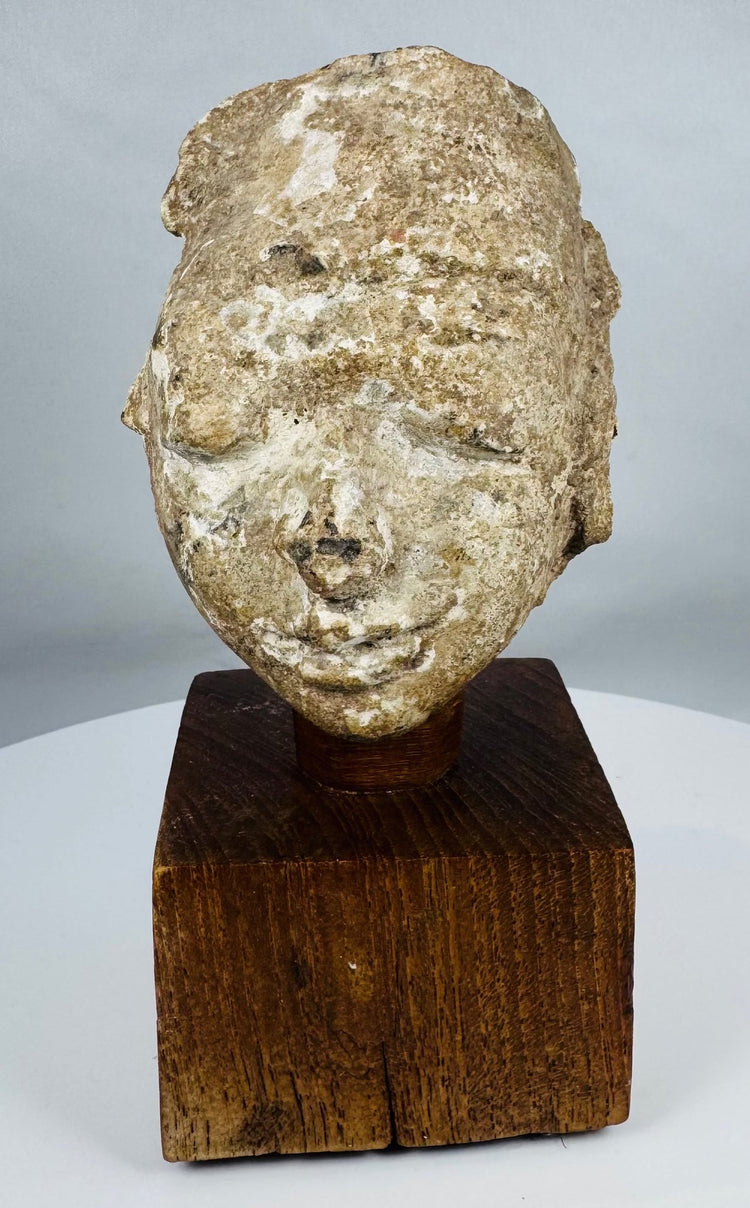 Ancient Buddhist stucco head fragment from the Kushan to Post-Kushan period