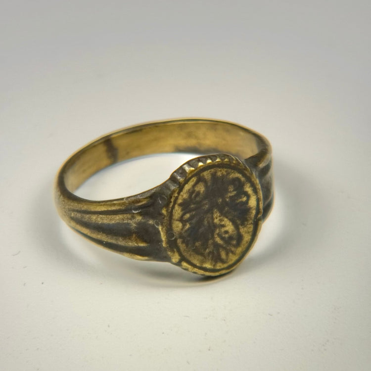 Late Roman to Early Byzantine bronze ring with surviving gold gilding and floral bezel design