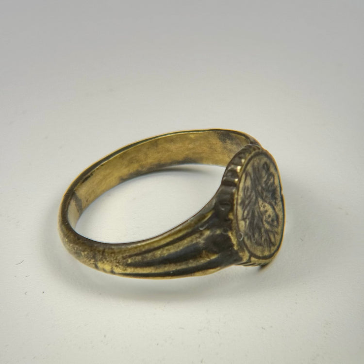 Late Roman bronze ring with decorative floral engraving and traces of original gold gilding
