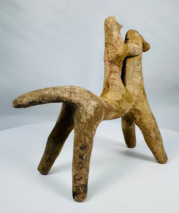 Hand-modeled Greek terracotta horse and rider figure from Boeotia mounted on a custom display stand.