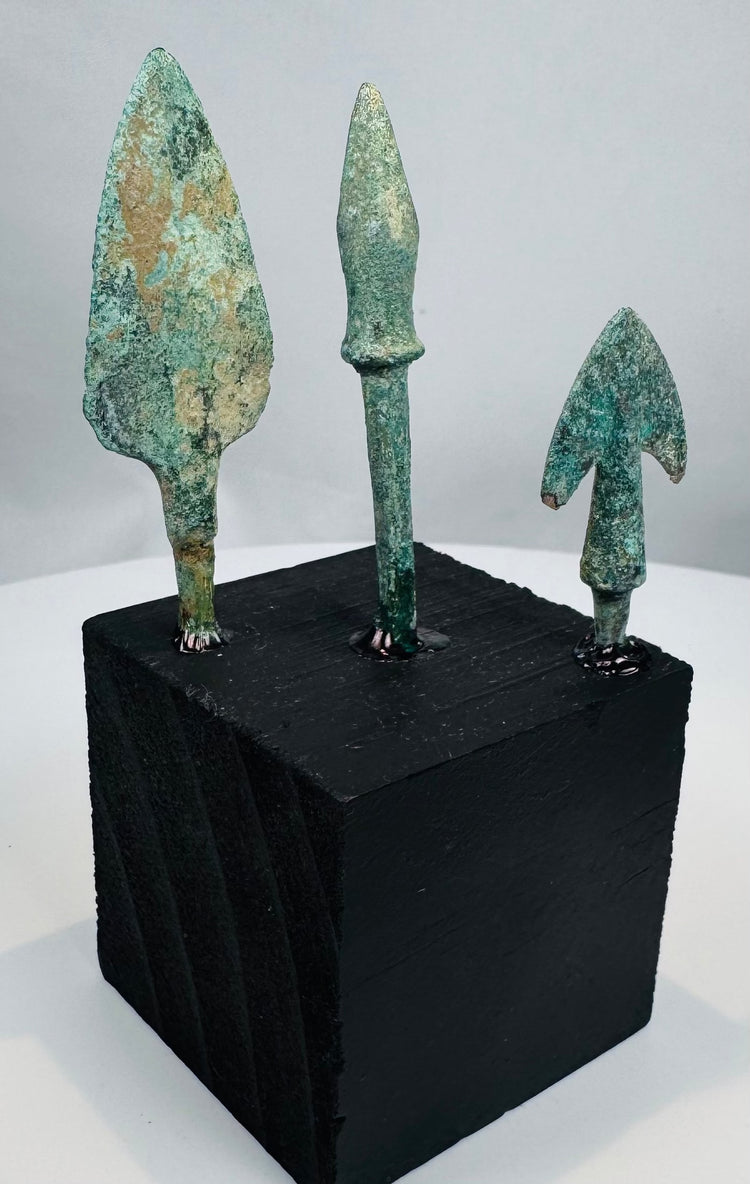 Slender lanceolate bronze arrowhead with pronounced collar and extended rectangular tang