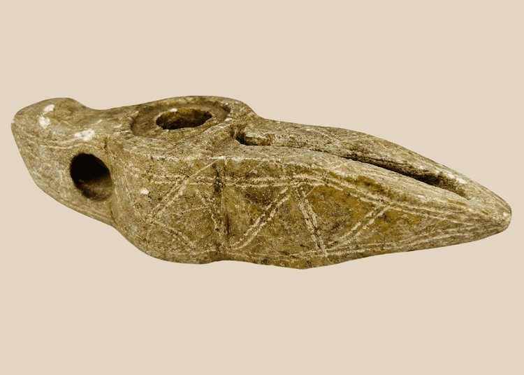 Ancient Islamic carved stone oil lamp with geometric decoration