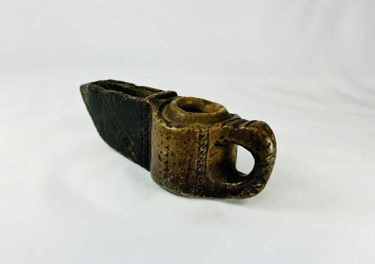 Early Islamic hand-carved stone oil lamp, 7th–12th century CE