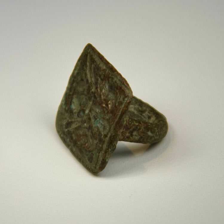 Historic bronze ring with legible twin bird engraving, square bezel, and centuries-old green patina