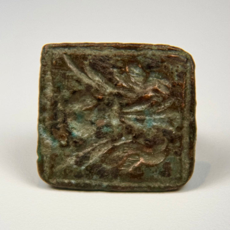 Ancient bronze ring with square bezel engraved with a paired bird motif, circa 1st–5th century CE