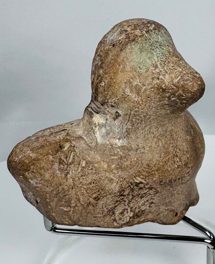 Classical Mediterranean earthenware bust fragment featuring almond-shaped eyes and softly modeled facial features.