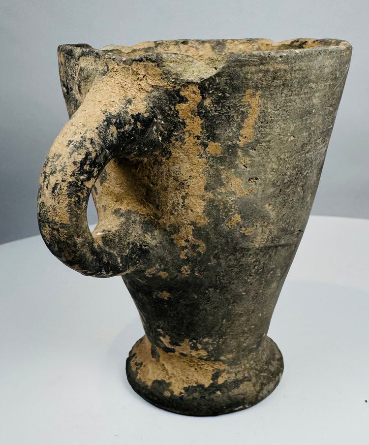 Front view of grayware terracotta goblet with deep conical bowl