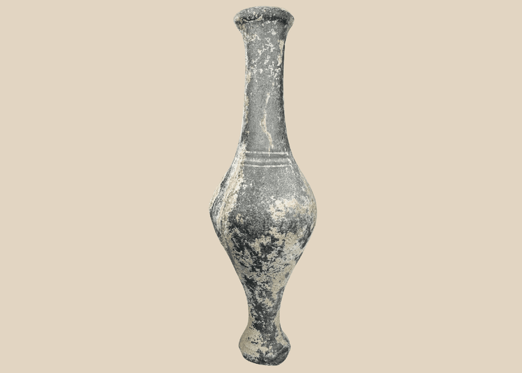 Ancient Iranian grayware spindle bottle with long neck and pedestal foot