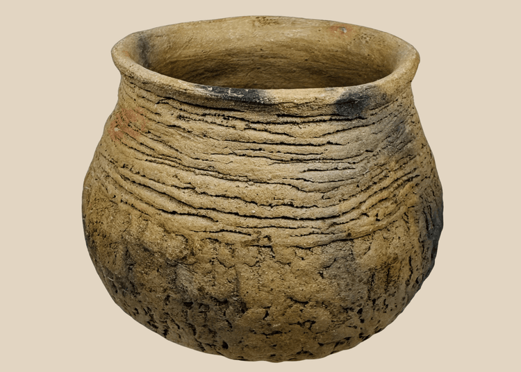 Ancient Casas Grandes corrugated pottery jar from northern Mexico featuring a globular body, wide mouth, and textured earthenware surface.
