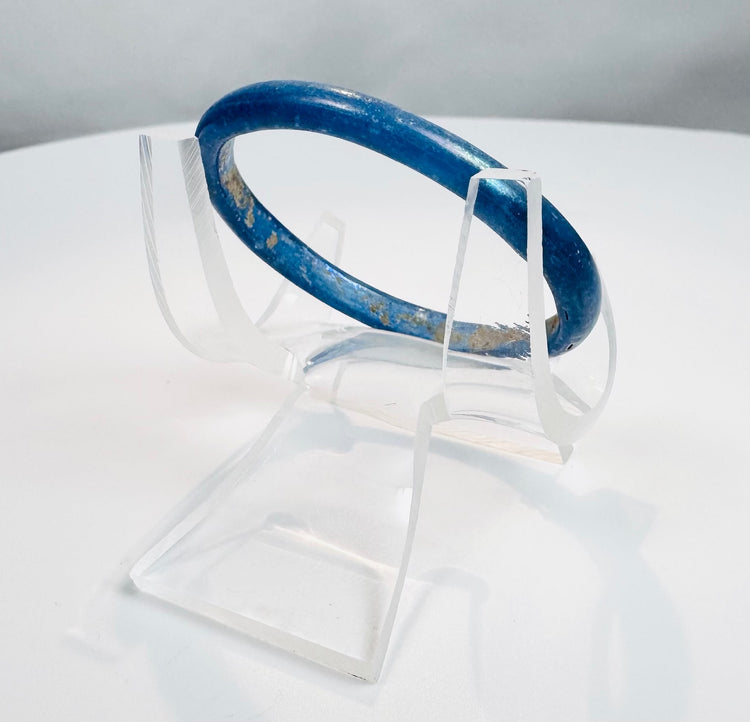 Roman Empire glass bracelet with smooth rounded profile and vivid cobalt-blue appearance.