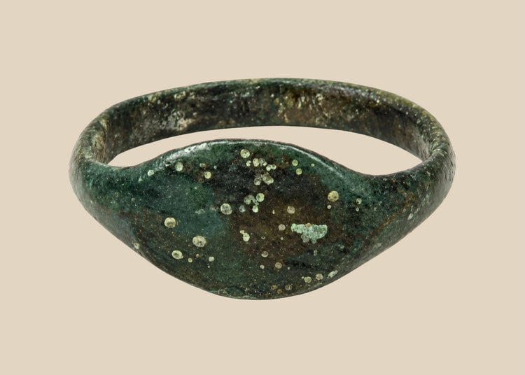 Ancient Roman bronze finger ring with broad plain oval bezel, circa 2nd–4th century CE