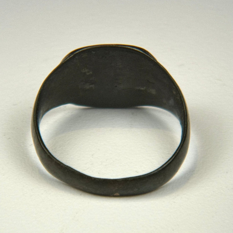 Ancient bronze jewelry from the Roman Empire with decorated flat bezel and centuries-old surface wear