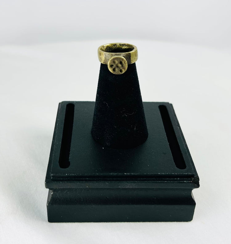 Top-down shot of Roman bronze ring emphasizing circular bezel alignment and craftsmanship.