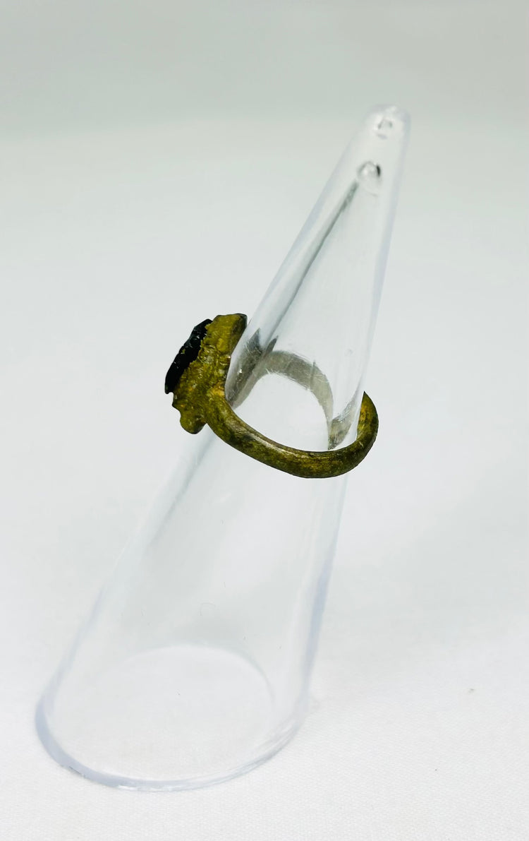Roman Imperial bronze ring with deep patina and inset carved red glass intaglio